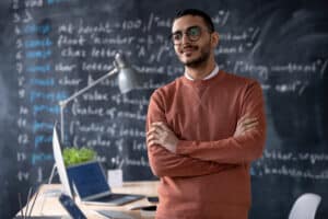 Male teacher thinking about financial software